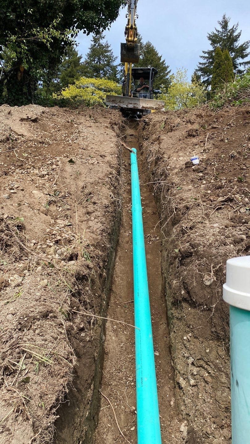 A green pipe in the trench.