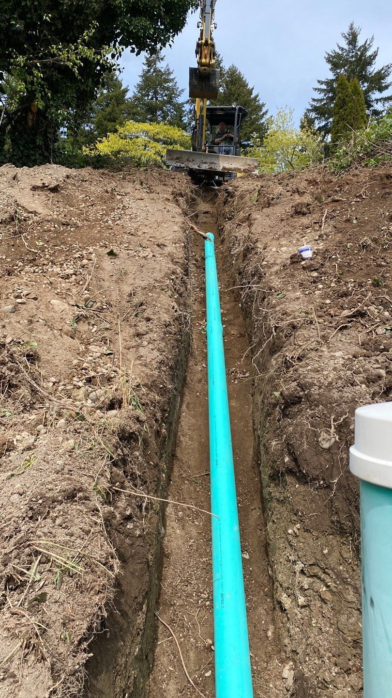A green pipe in the trench.