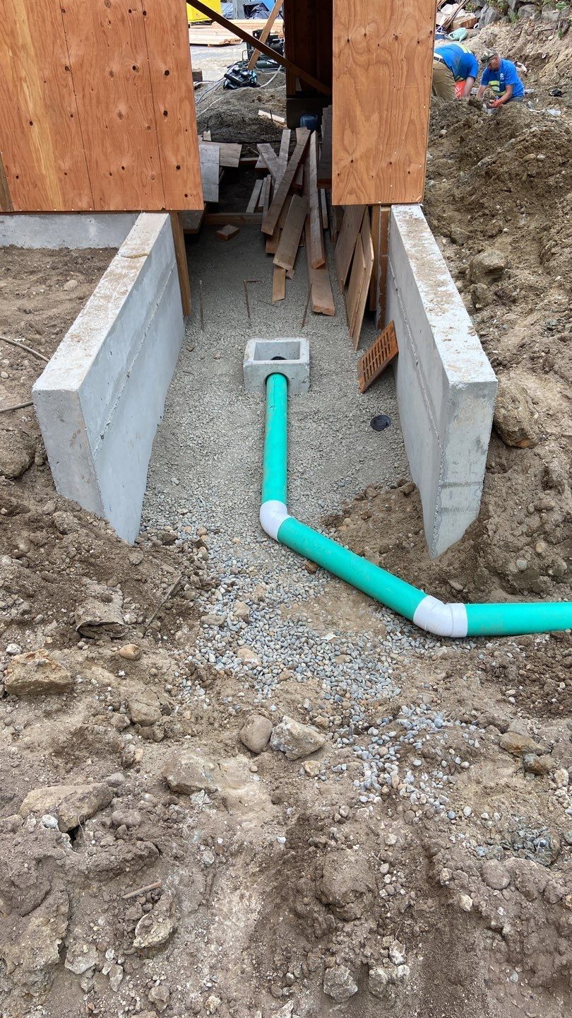 Drain entry box for the base of the stairs.
