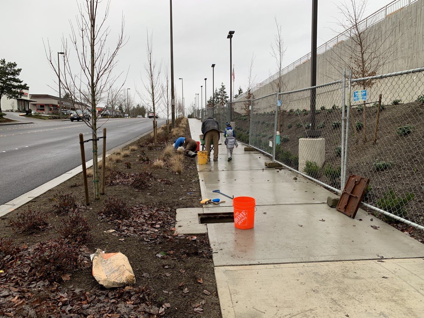 New greenbelt plantings and sidewalks installed along the road. The cement "wall" on the right is the side of the larger stormwater vault.