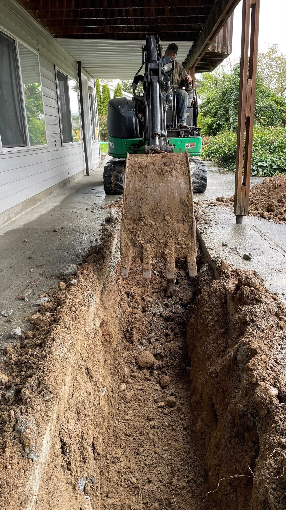 Excavation in a tight space is managed with the properly-sized equipment.